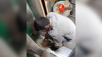 ट्रेन के टॉयलेट के पास फर्श पर खाना बनाते व्यक्ति का दृश्य, वायरल वीडियो